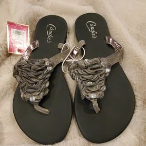 Candie's silver flat thong sandals with decorative ruffles and rhinestones. 5-6